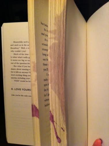 First, Paulie spilled his wine on my book